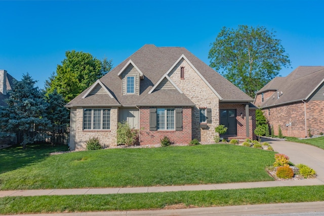 853 E Grafton Dr, Nixa, MO 65714 - view of front of property featuring a front yard, brick siding, and a shingled roof