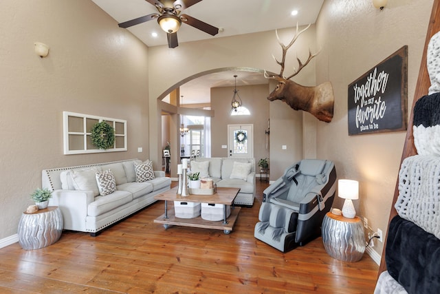 1415 Woodland Rd, Marshfield, MO 65706 - living room with arched walkways, a ceiling fan, wood-type flooring, baseboards, and recessed lighting