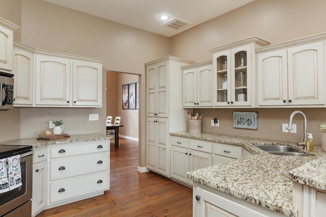 1415 Woodland Rd, Marshfield, MO 65706 - kitchen with a sink, stainless steel range with electric cooktop, cream cabinets, light stone counters, and recessed lighting