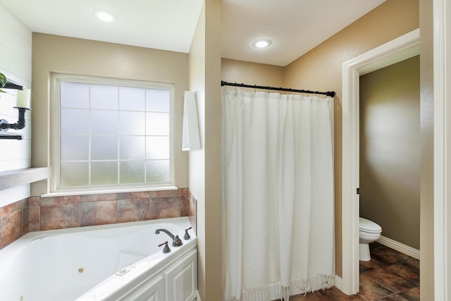 1415 Woodland Rd, Marshfield, MO 65706 - bathroom featuring a tub with jets, toilet, a shower with shower curtain, and baseboards