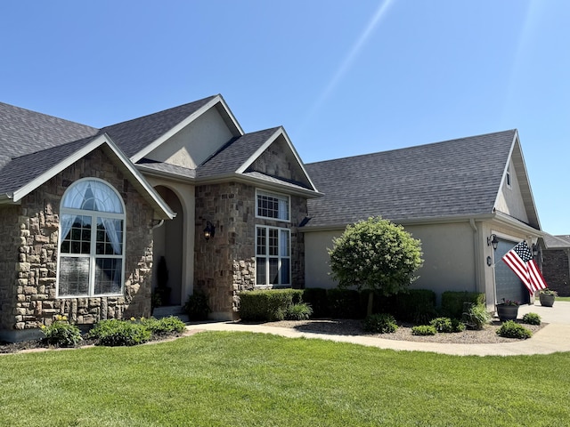 1415 Woodland Rd, Marshfield, MO 65706 - view of front facade with stone siding, a garage, a front lawn, and stucco siding
