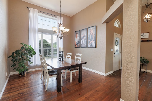 1415 Woodland Rd, Marshfield, MO 65706 - dining area with a chandelier, dark wood-style flooring, baseboards, and a textured wall