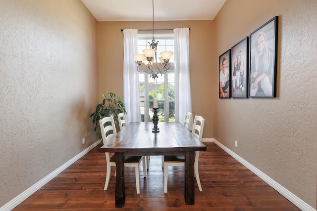 1415 Woodland Rd, Marshfield, MO 65706 - dining room with a textured wall, a chandelier, dark wood-style floors, and baseboards