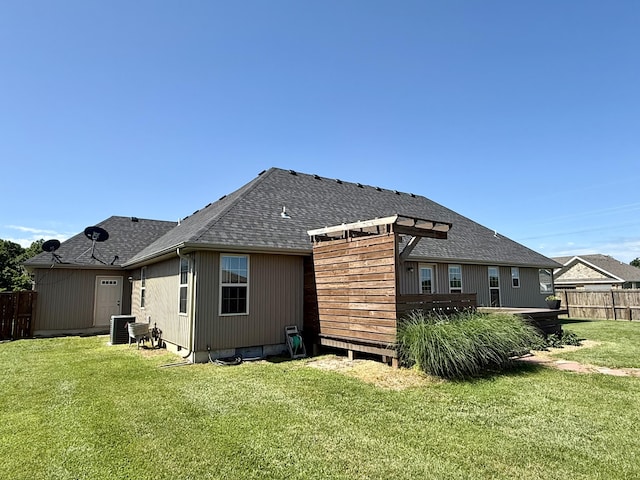 1415 Woodland Rd, Marshfield, MO 65706 - rear view of property featuring roof with shingles and central AC unit