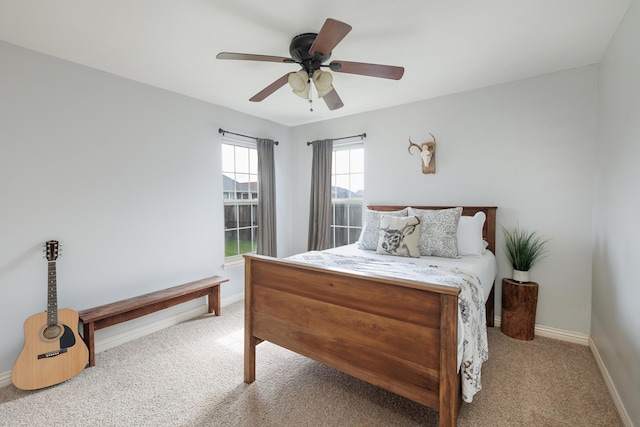 1415 Woodland Rd, Marshfield, MO 65706 - carpeted bedroom with baseboards and a ceiling fan