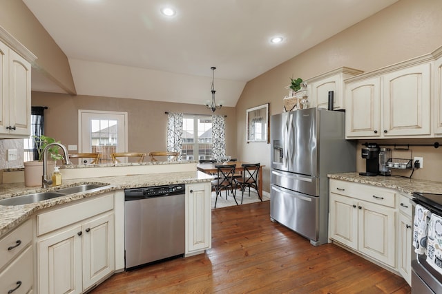 1415 Woodland Rd, Marshfield, MO 65706 - kitchen featuring appliances with stainless steel finishes, a sink, lofted ceiling, a chandelier, and light wood-style flooring