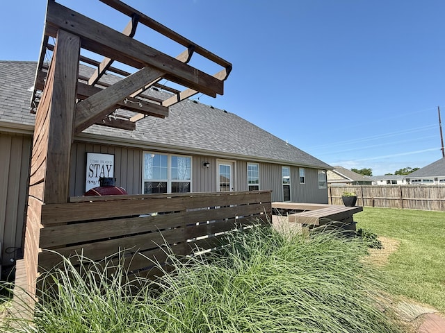 1415 Woodland Rd, Marshfield, MO 65706 - back of house featuring roof with shingles and a pergola