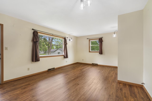300 S High Ave, Ash Grove, MO 65604 - empty room with wood finished floors and baseboards