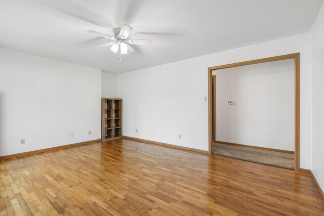 300 S High Ave, Ash Grove, MO 65604 - spare room featuring light wood finished floors, a ceiling fan, and baseboards