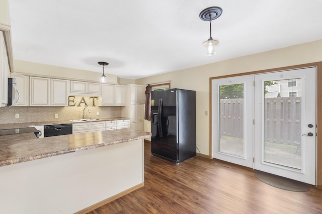 300 S High Ave, Ash Grove, MO 65604 - kitchen featuring black appliances, a sink, dark wood-style floors, a peninsula, and decorative light fixtures