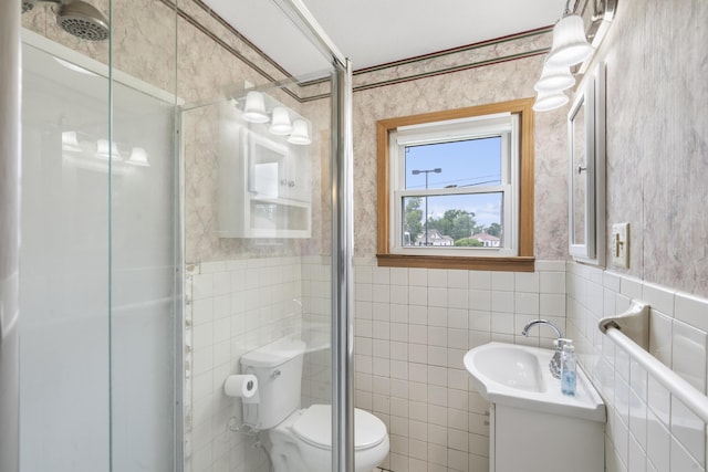 300 S High Ave, Ash Grove, MO 65604 - bathroom with toilet, vanity, wallpapered walls, tile walls, and wainscoting