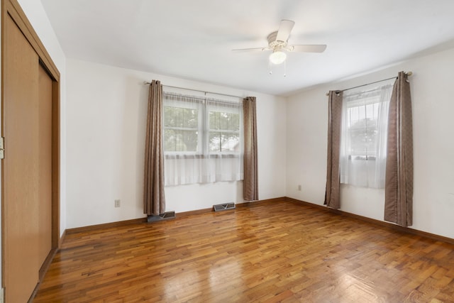 300 S High Ave, Ash Grove, MO 65604 - unfurnished room with healthy amount of natural light, light wood-type flooring, ceiling fan, and baseboards