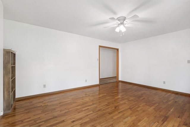 300 S High Ave, Ash Grove, MO 65604 - unfurnished room with ceiling fan, wood finished floors, and baseboards