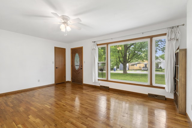 300 S High Ave, Ash Grove, MO 65604 - unfurnished room with wood finished floors, baseboards, and a ceiling fan