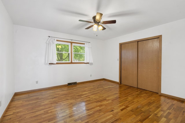300 S High Ave, Ash Grove, MO 65604 - unfurnished bedroom with wood finished floors, baseboards, a closet, and ceiling fan