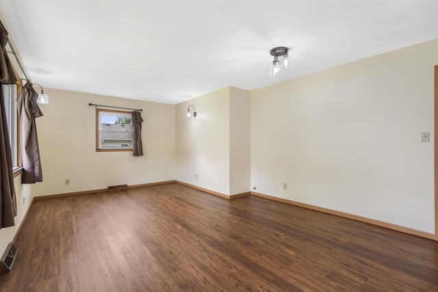 300 S High Ave, Ash Grove, MO 65604 - spare room featuring wood finished floors and baseboards