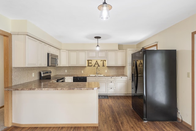 300 S High Ave, Ash Grove, MO 65604 - kitchen with black appliances, a sink, a peninsula, decorative backsplash, and hanging light fixtures