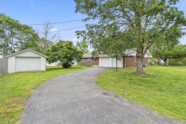 300 S High Ave, Ash Grove, MO 65604 - view of front facade featuring driveway and brick siding