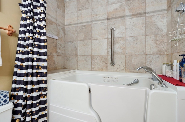 413 W Chestnut Rd, Nixa, MO 65714 - bathroom with a bathtub and toilet