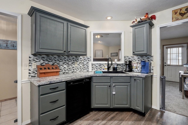 413 W Chestnut Rd, Nixa, MO 65714 - kitchen with gray cabinetry, black dishwasher, a sink, light countertops, and tasteful backsplash