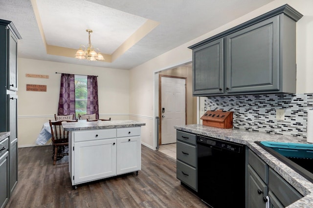 413 W Chestnut Rd, Nixa, MO 65714 - kitchen with black dishwasher, a chandelier, a raised ceiling, dark wood-style flooring, and a textured ceiling