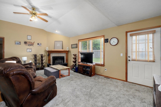 413 W Chestnut Rd, Nixa, MO 65714 - living area featuring carpet floors, a ceiling fan, a tiled fireplace, lofted ceiling, and baseboards