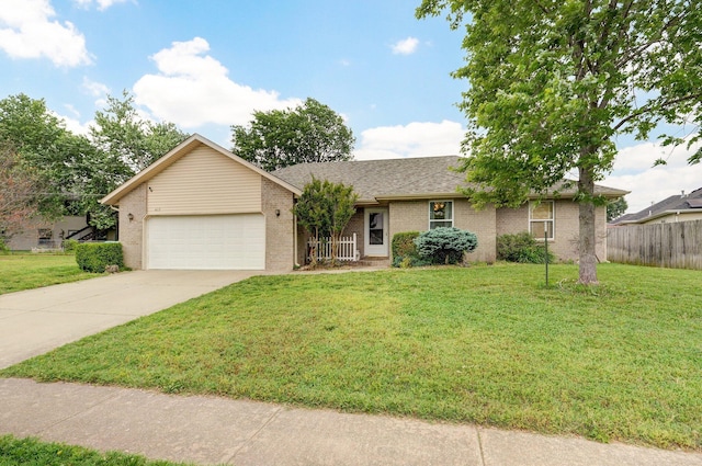 413 W Chestnut Rd, Nixa, MO 65714 - single story home featuring an attached garage, concrete driveway, brick siding, and a shingled roof