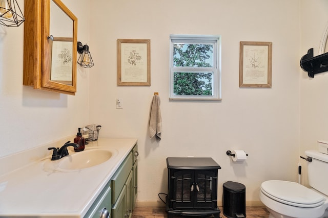 1899 State Highway Dd, Ava, MO 65608 - half bathroom featuring vanity, toilet, wood finished floors, and baseboards