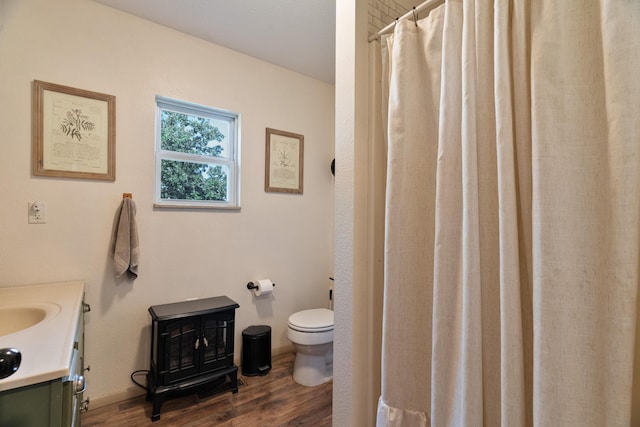 1899 State Highway Dd, Ava, MO 65608 - full bathroom featuring toilet, wood finished floors, vanity, and a shower with shower curtain