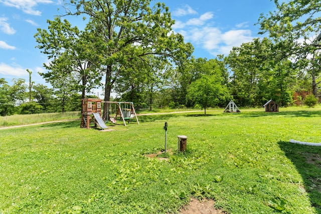1899 State Highway Dd, Ava, MO 65608 - view of green lawn with a playground, a storage shed, and view of scattered trees