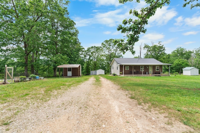 1899 State Highway Dd, Ava, MO 65608 - ranch-style house featuring covered porch, dirt driveway, a front lawn, and view of scattered trees