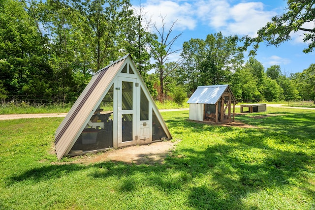1899 State Highway Dd, Ava, MO 65608 - view of jungle gym with exterior structure, a lawn, and an outbuilding
