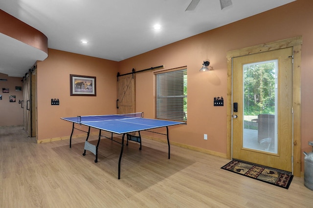 8403 Lawrence Unit 1040, La Russell, MO 64848 - game room featuring a barn door, light wood finished floors, baseboards, and recessed lighting