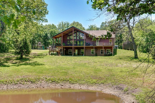 8403 Lawrence Unit 1040, La Russell, MO 64848 - back of house featuring a yard and a deck with water view