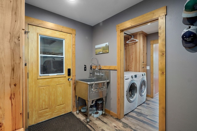8403 Lawrence Unit 1040, La Russell, MO 64848 - washroom featuring independent washer and dryer and wood finished floors