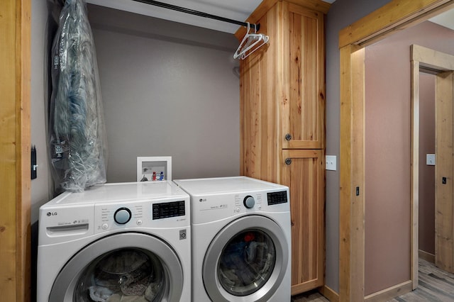 8403 Lawrence Unit 1040, La Russell, MO 64848 - laundry room featuring washer and clothes dryer and cabinet space