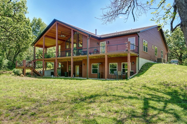 8403 Lawrence Unit 1040, La Russell, MO 64848 - back of house with a wooden deck, central air condition unit, a lawn, and stairway