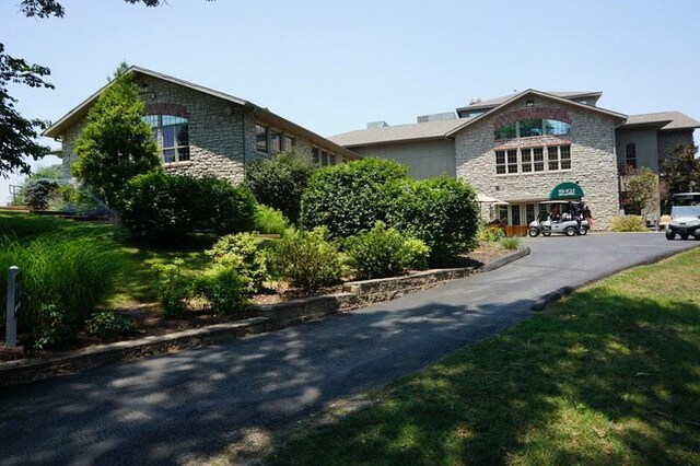 280 Wimbledon Dr Unit 8, Branson, MO 65616 - view of side of home featuring stone siding