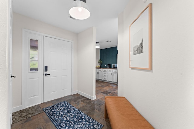 280 Wimbledon Dr Unit 8, Branson, MO 65616 - entrance foyer with stone tile flooring and baseboards