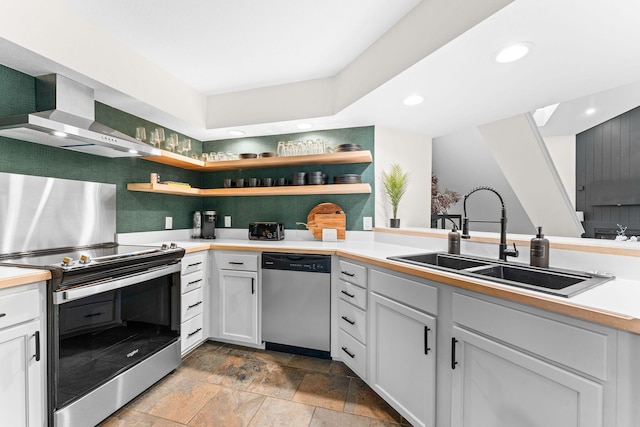 280 Wimbledon Dr Unit 8, Branson, MO 65616 - kitchen with stainless steel appliances, wall chimney range hood, a sink, open shelves, and recessed lighting
