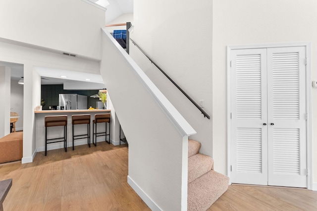280 Wimbledon Dr Unit 8, Branson, MO 65616 - stairway with wood finished floors and baseboards