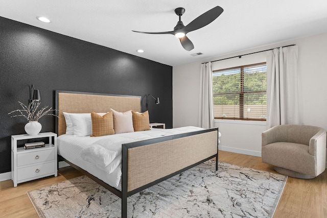 280 Wimbledon Dr Unit 8, Branson, MO 65616 - bedroom with wood finished floors, baseboards, ceiling fan, recessed lighting, and an accent wall