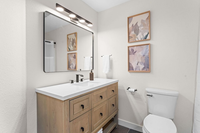280 Wimbledon Dr Unit 8, Branson, MO 65616 - bathroom featuring vanity, toilet, and baseboards