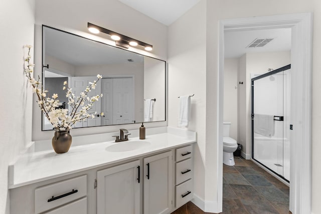 280 Wimbledon Dr Unit 8, Branson, MO 65616 - full bathroom with vanity, a stall shower, toilet, and stone finish floors
