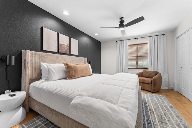 280 Wimbledon Dr Unit 8, Branson, MO 65616 - bedroom featuring a textured wall, a closet, light wood finished floors, ceiling fan, and recessed lighting