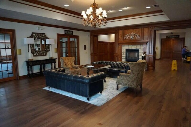 280 Wimbledon Dr Unit 8, Branson, MO 65616 - living area featuring a raised ceiling, a fireplace, crown molding, a chandelier, and dark wood finished floors