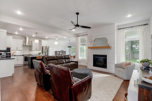 735 N Fox Hill Cir, Nixa, MO 65714 - living room featuring a ceiling fan, plenty of natural light, dark wood finished floors, and recessed lighting