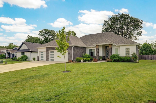 735 N Fox Hill Cir, Nixa, MO 65714 - view of front of home featuring a garage, concrete driveway, brick siding, and roof with shingles