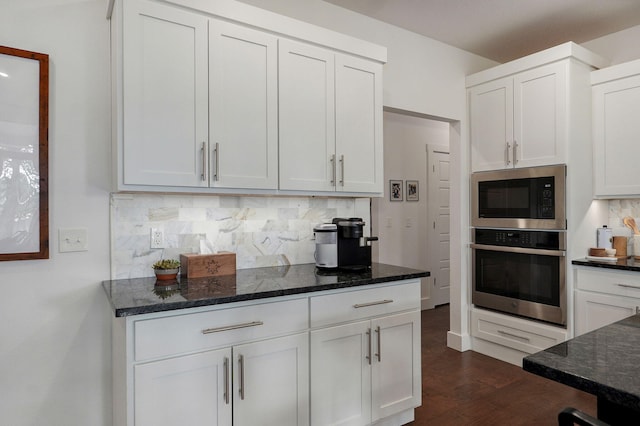 735 N Fox Hill Cir, Nixa, MO 65714 - kitchen with oven, built in microwave, backsplash, white cabinetry, and dark wood finished floors
