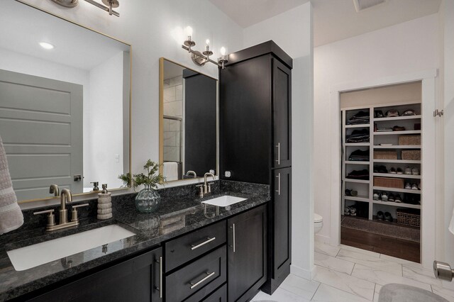 735 N Fox Hill Cir, Nixa, MO 65714 - bathroom with toilet, double vanity, marble finish floors, and a walk in closet